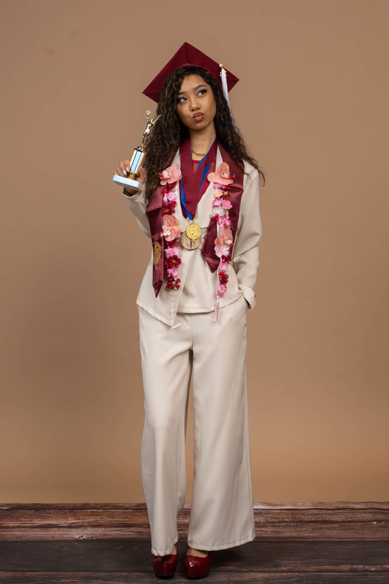 Inaya in cream suit — formal portrait